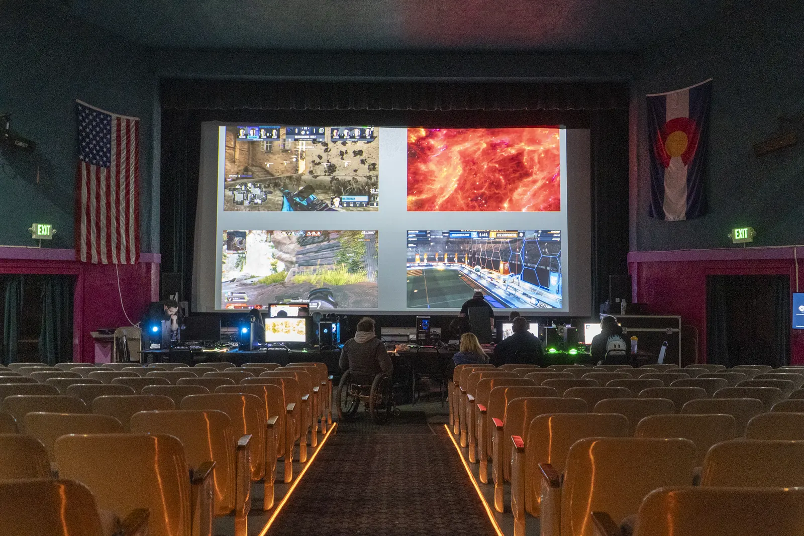 Gaming PCs and players in the Fox Theatre with four games projected on the big screen