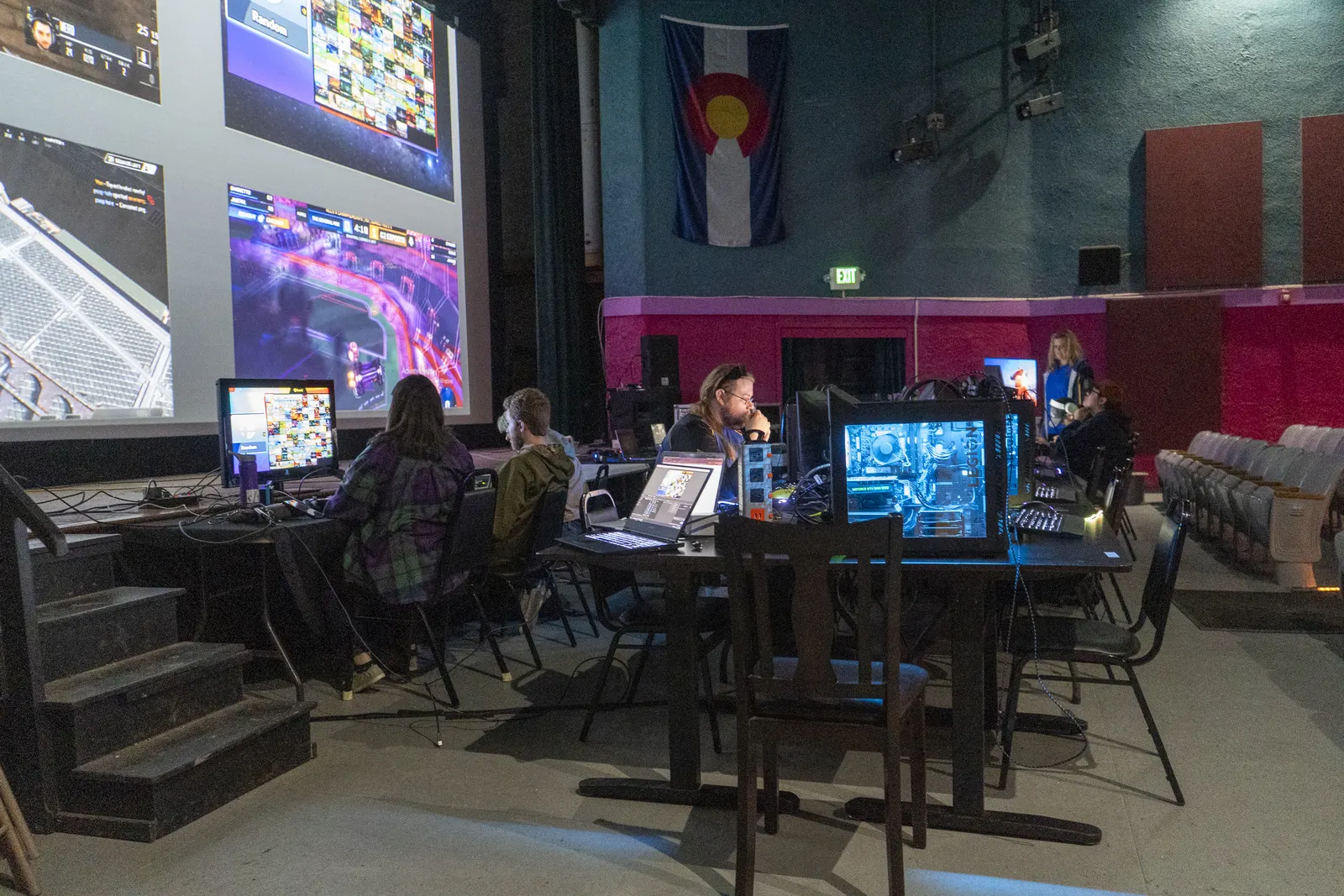 A wide view of the Fox Gaming Lounge with gaming PCs, players, and theater seating
