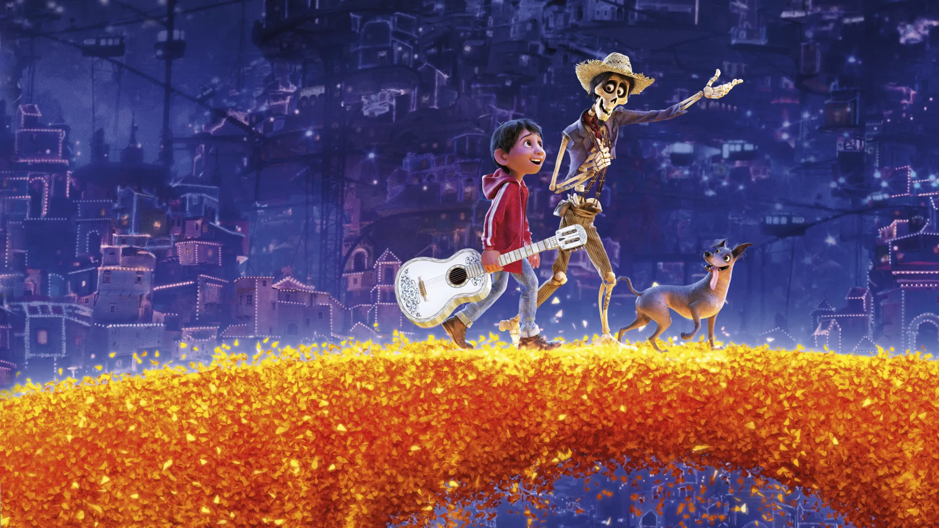 Miguel and Hector stand together on a glowing marigold bridge in Disney/Pixar's Coco.