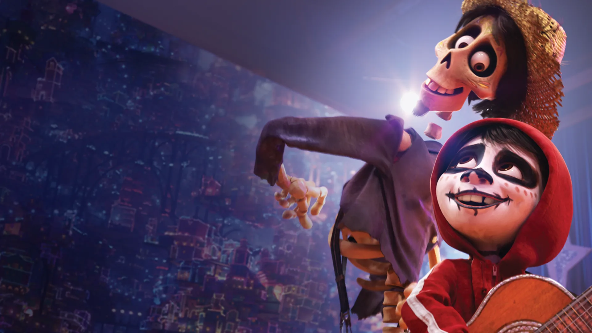 Miguel and Dante look ahead together in a colorful nighttime scene from Disney/Pixar's Coco.