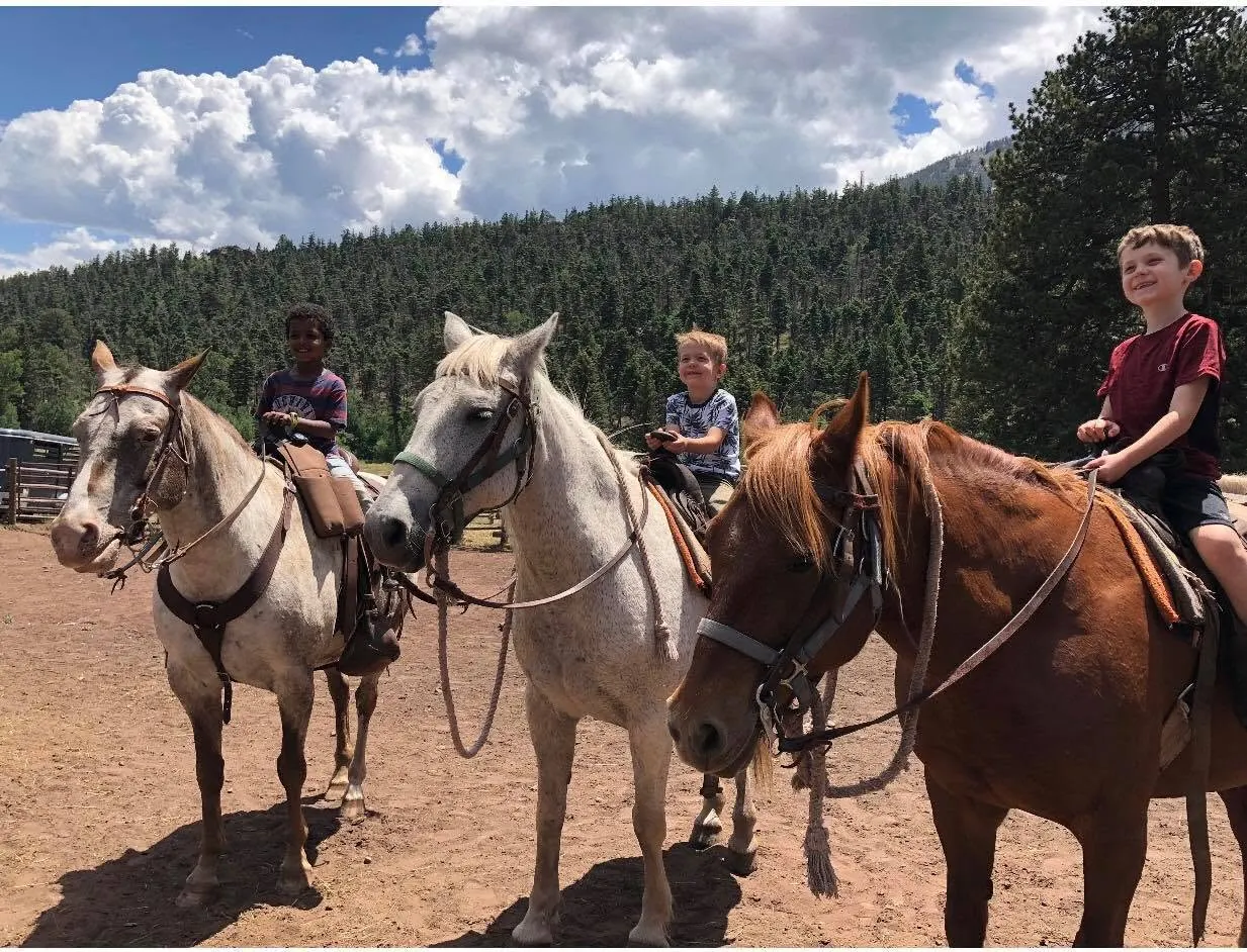 Guests on horseback at Yellow Pine Guest Ranch.