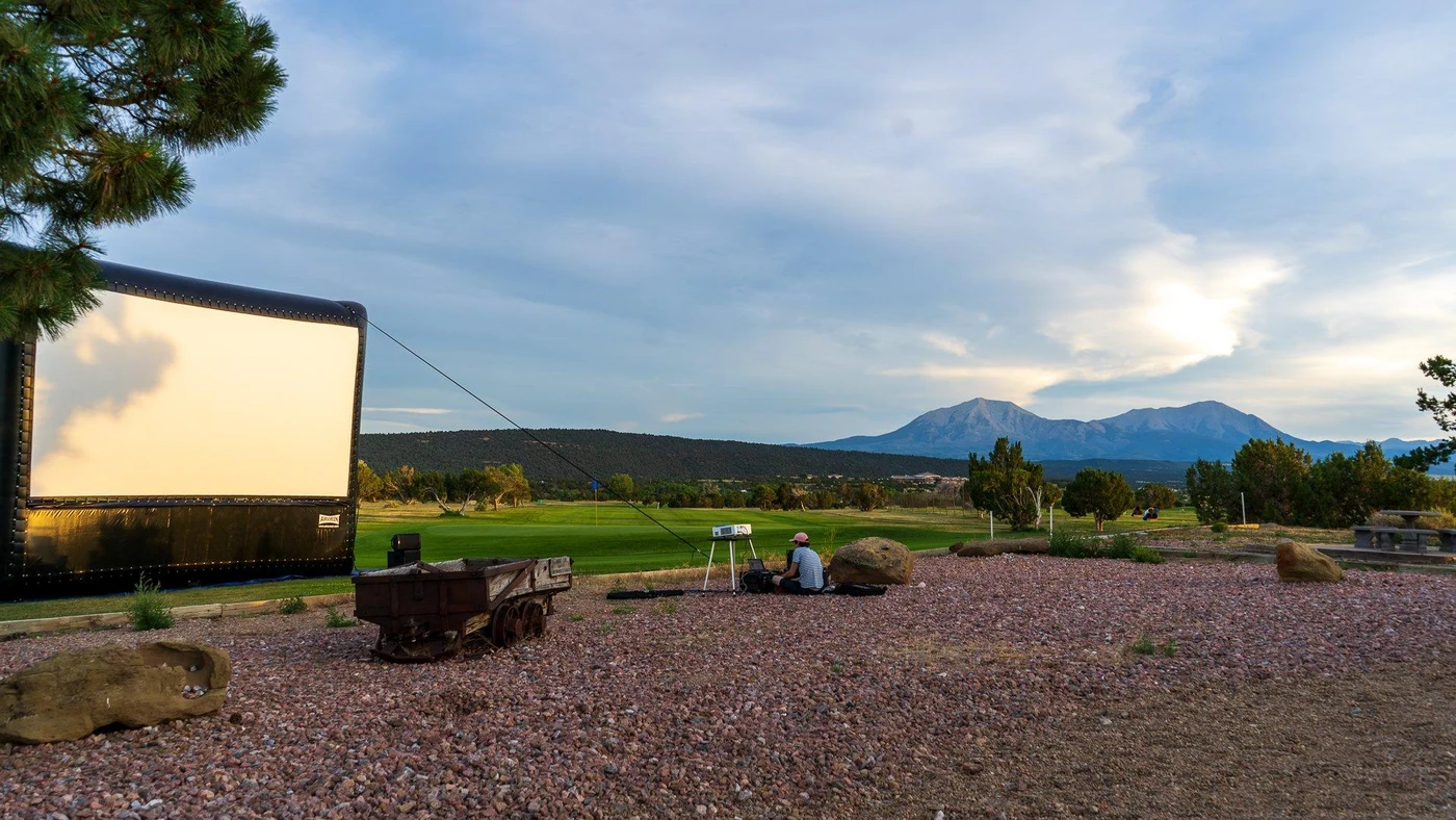 Fox Theatre outdoor movie screen set up beneath the Spanish Peaks.