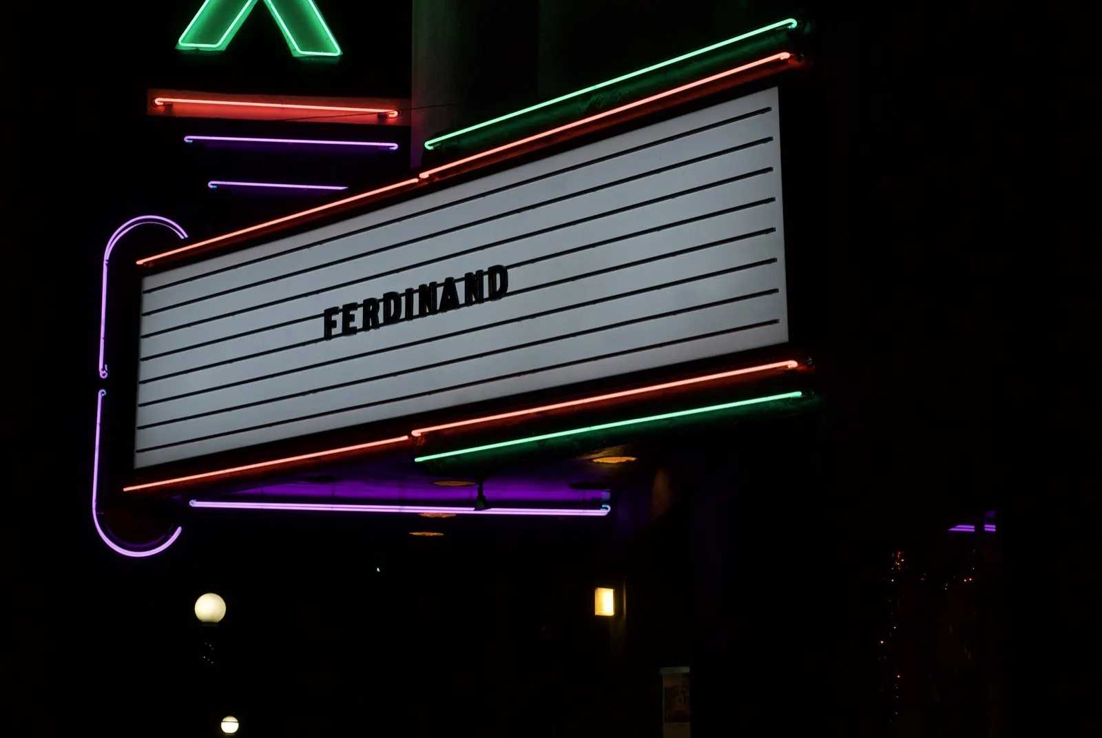 Lit Fox Theatre marquee at night after the 2017 neon restoration, with Ferdinand on the readerboard.