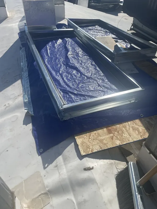 A covered rooftop opening during the heating and cooling work.
